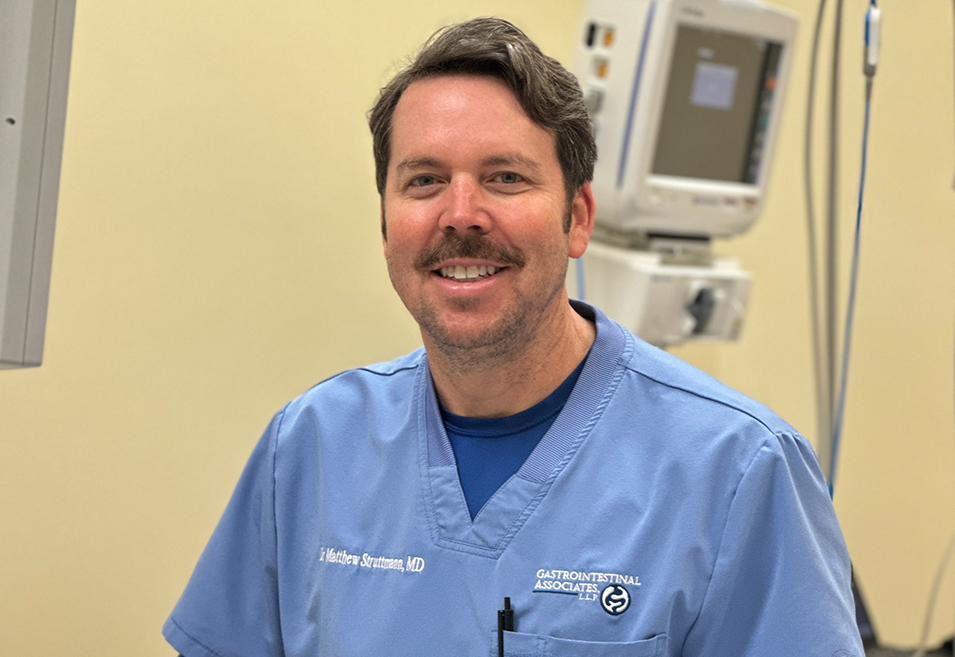 Arthur Struttmann, MD, smiling in a clinical setting.
