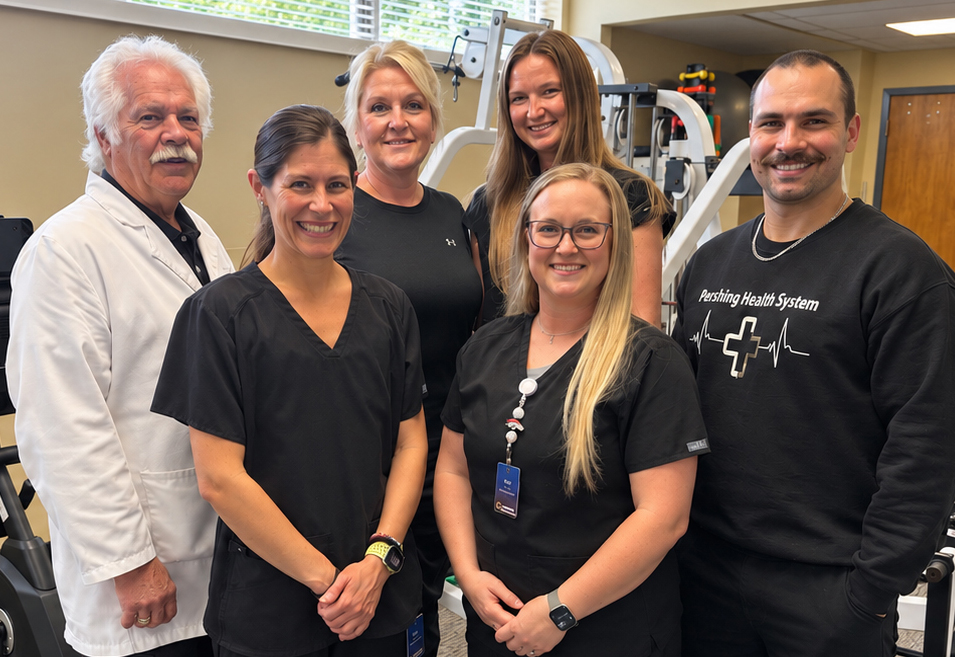 Pershing Health System Physical Therapy team members standing together in the rehabilitation department at Pershing Memorial Hospital in Brookfield, Missouri